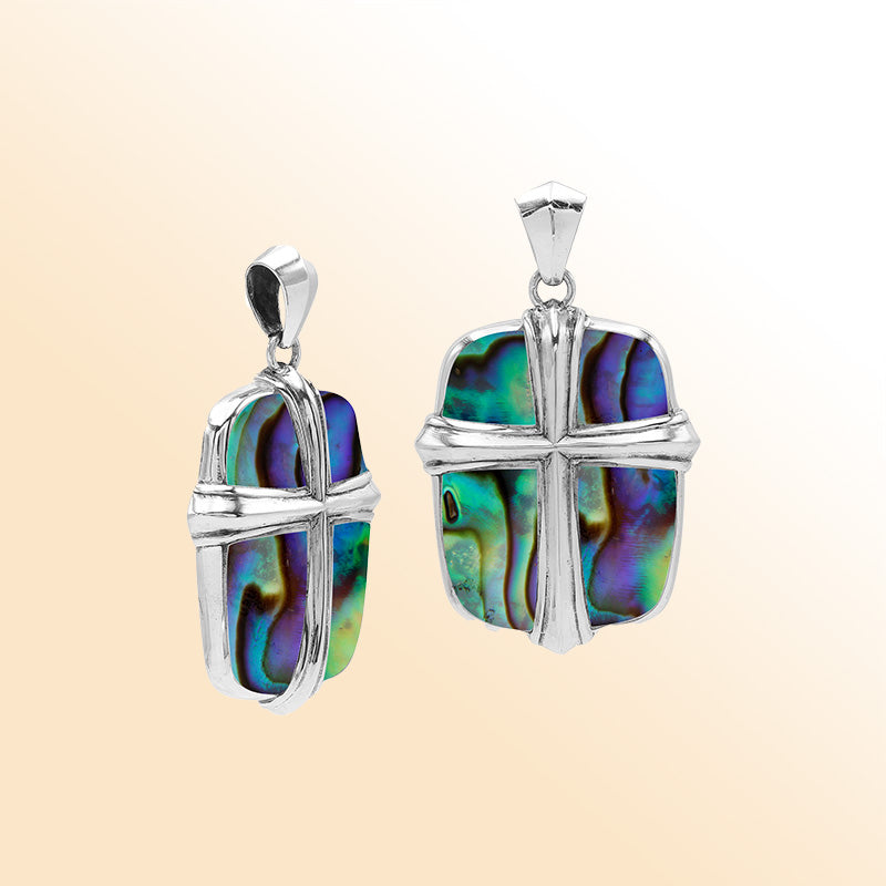 Sterling silver cross pendant with vibrant abalone shell inlay, handcrafted Bali jewelry with iridescent ocean-inspired colors.