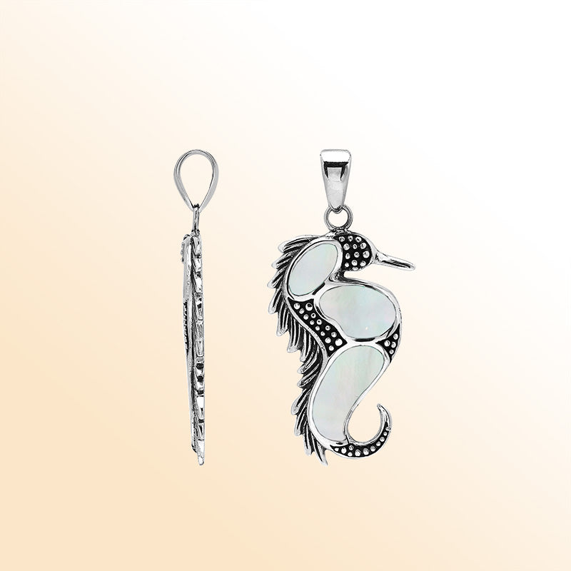 Sterling silver seahorse pendant with genuine mother of pearl inlay, handcrafted in Bali – elegant ocean-inspired jewelry for everyday wear or gifting.