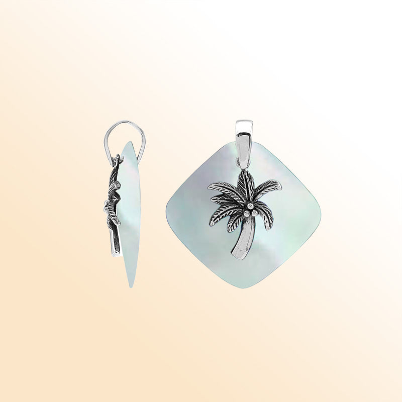 Elegant sterling silver palm tree pendant with Mother of Pearl diamond base, artisan-crafted for tropical coastal style.