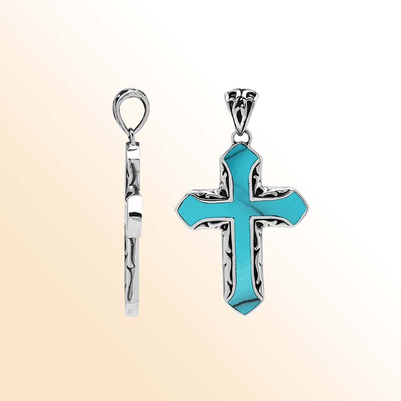 Sterling Silver Cross Pendant With Turquoise Shell Inlay And Intricate Balinese Scrollwork In A Graceful Artisan Design.