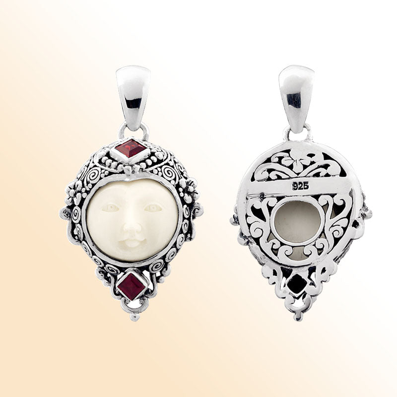 Handcrafted sterling silver pendant with Red Garnet Quartz accents and carved bone face, Bali-inspired jewelry.