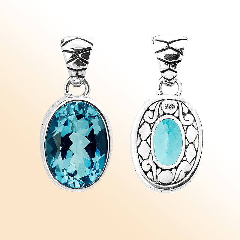 Handmade sterling silver pendant with oval-cut Blue Topaz Quartz and artisan scroll design, Bali jewelry.