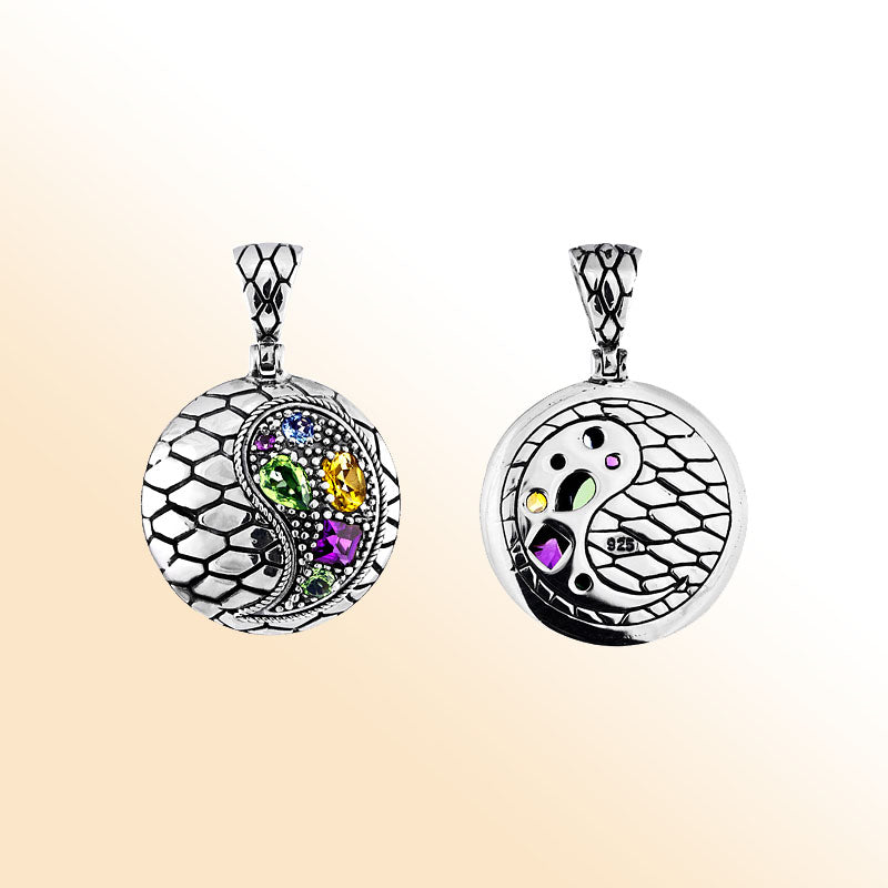 Yin Yang sterling silver pendant with peridot, citrine, blue topaz, and amethyst quartz in artisan design.