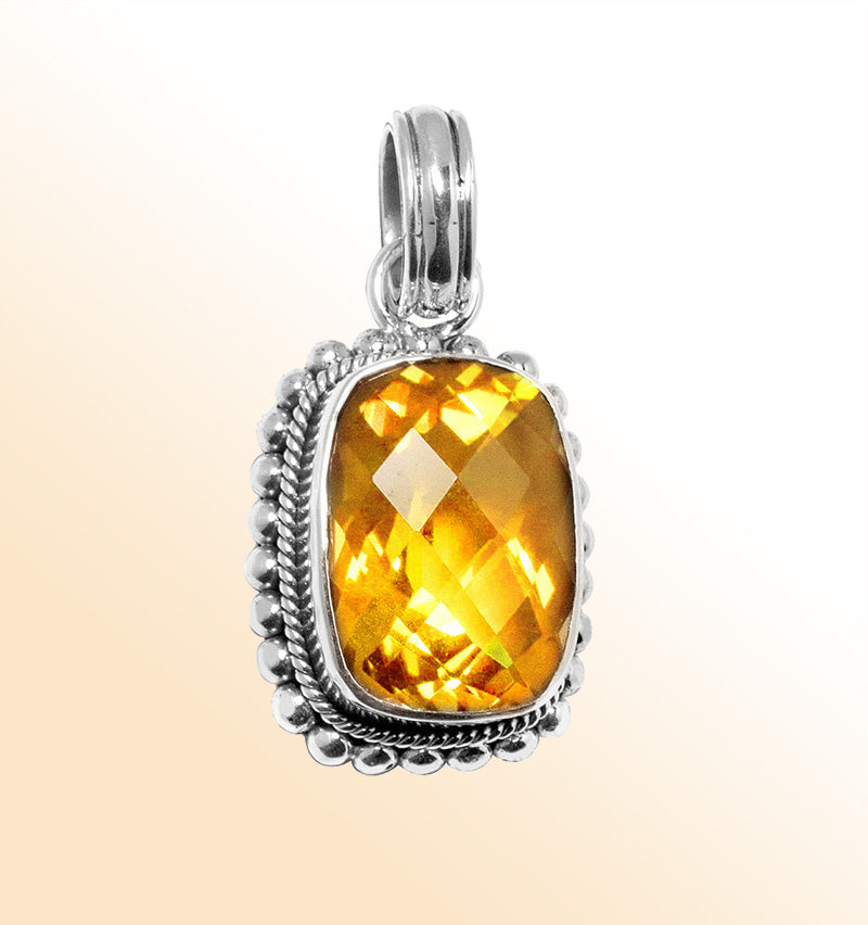 Handmade sterling silver pendant with faceted Citrine Quartz, artisan crafted in Bali