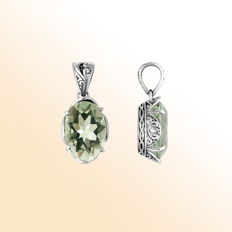 Sterling silver pendant with faceted oval green amethyst quartz, Balinese handcrafted with carved sides and oxidized detailing.