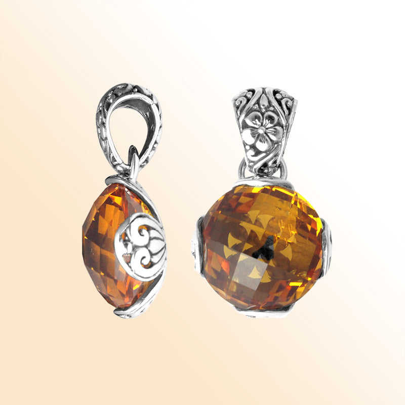 Handmade sterling silver pendant with faceted Citrine Quartz and Balinese floral swirl details, artisan crafted in Bali.