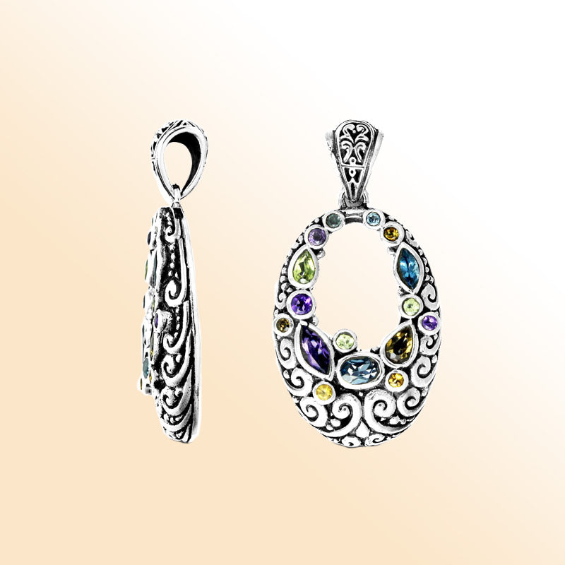 Handmade sterling silver oval pendant with Amethyst Quartz, Blue Topaz Quartz, Peridot Quartz, and Citrine Quartz in Balinese scroll design, artisan crafted in Bali.