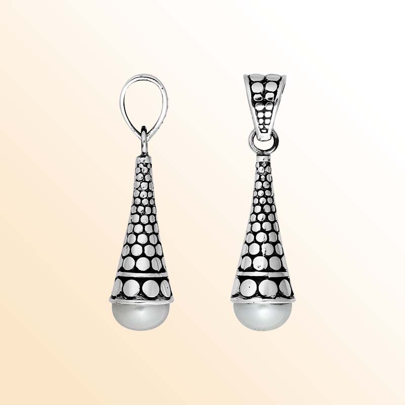 Handcrafted sterling silver pearl pendant featuring traditional Indonesian dot-work and oxidized finish.