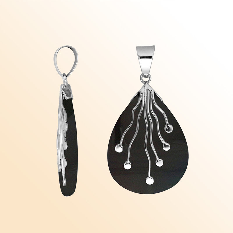 Sterling silver teardrop pendant with polished black shell and flowing silver wire accents – handcrafted artisan jewelry for women.