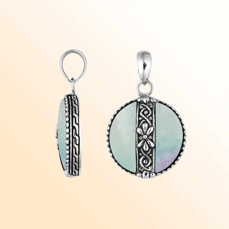 Elegant Sterling Silver Mother Of Pearl round pendant with floral center design, handcrafted mirror-polished finish, and iridescent luster for women’s artistic jewelry collections.