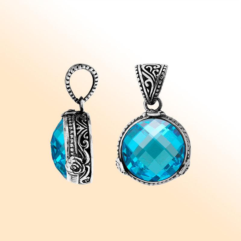 A radiant 925 sterling silver pendant featuring a round faceted Blue Topaz Quartz stone with modern Balinese artistry and fine handcrafted metal detailing.