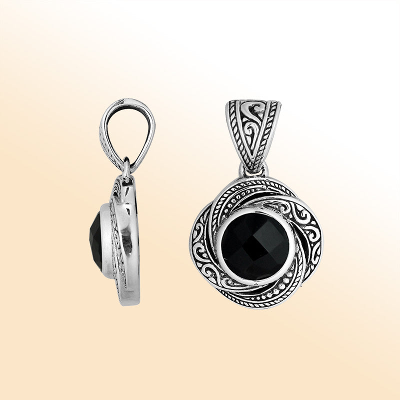 A beautifully handcrafted sterling silver pendant featuring a polished Black Onyx embraced by swirling filigree, reflecting artistic Balinese craftsmanship and elegant feminine charm.