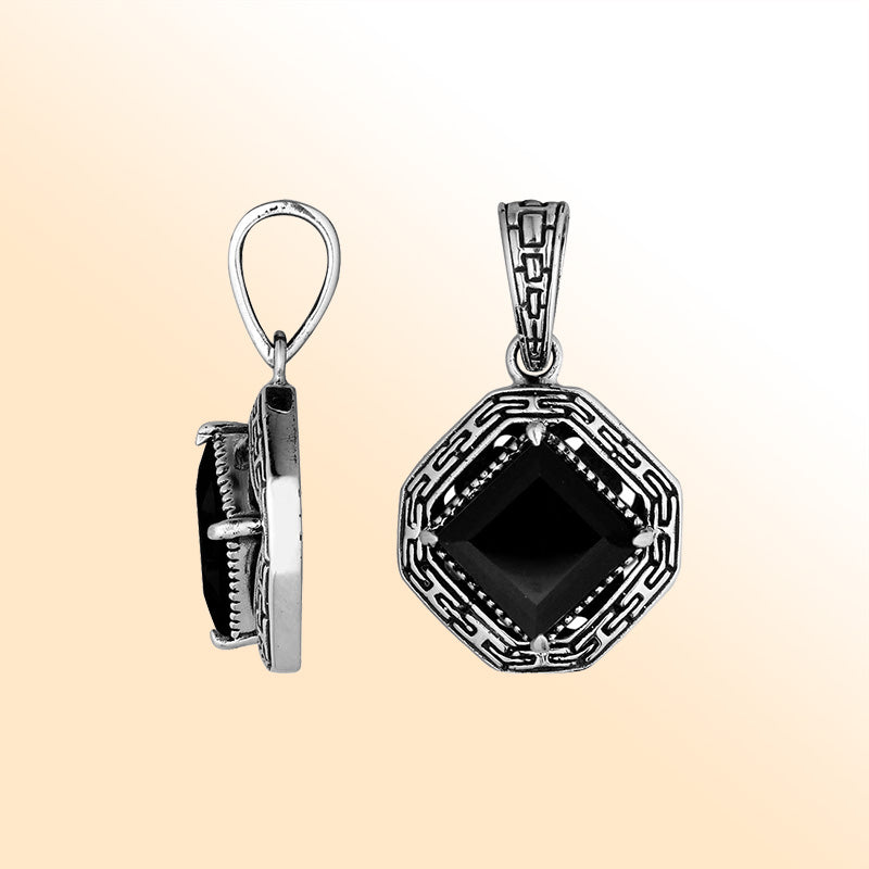 An elegant sterling silver pendant featuring a radiant Black Onyx in a geometric Greek key frame, handcrafted with Balinese artistry and detailed silverwork.