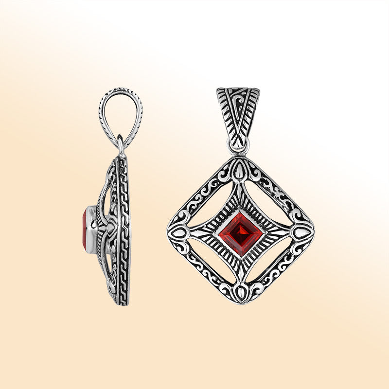An elegant sterling silver pendant featuring a deep Red Garnet Quartz in a detailed Balinese filigree frame, handcrafted with intricate artistry and shine.