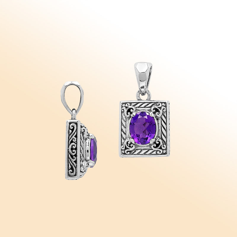 Elegant sterling silver pendant featuring an oval amethyst quartz in a rectangular frame with swirl engravings and polished high-gloss Balinese finish.