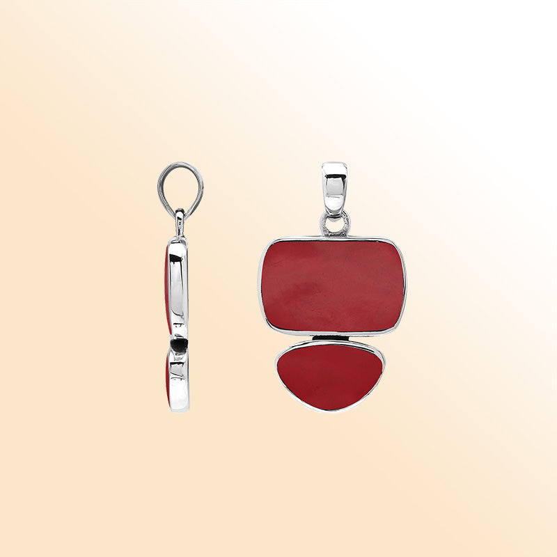 Handcrafted sterling silver double-shape pendant featuring Red Coral stones, polished smooth surface, and detailed Balinese artistry.