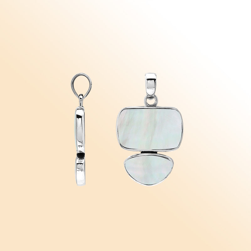 Handcrafted sterling silver double-shape pendant with Mother Of Pearl stones, smooth polished surface, and refined Balinese artistic detailing.