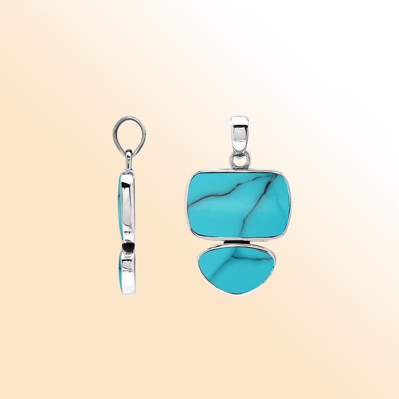 Handcrafted sterling silver pendant with two Turquoise Shell stones, mirror-polished surface, and detailed modern Balinese craftsmanship.