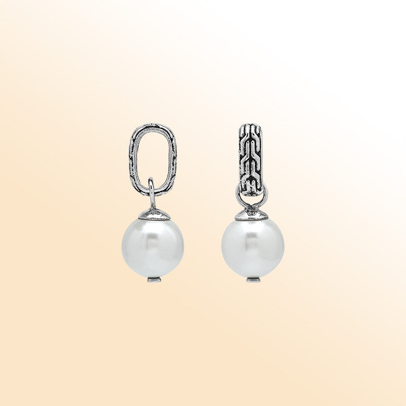 Elegant sterling silver round drop pendant featuring a radiant Mabe Pearl and Balinese silver detailing with smooth high-gloss finish.