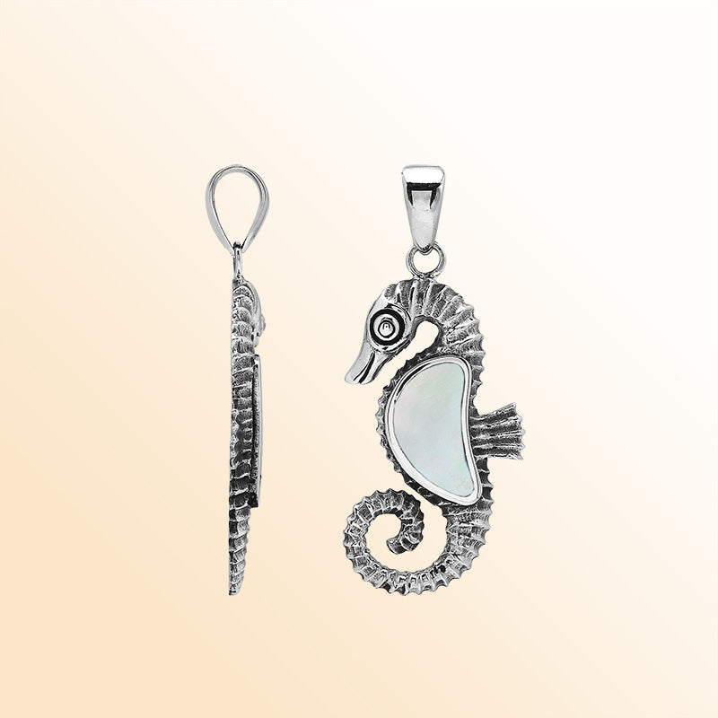 Handcrafted sterling silver seahorse pendant with lustrous Mother Of Pearl and polished Balinese design detailing.