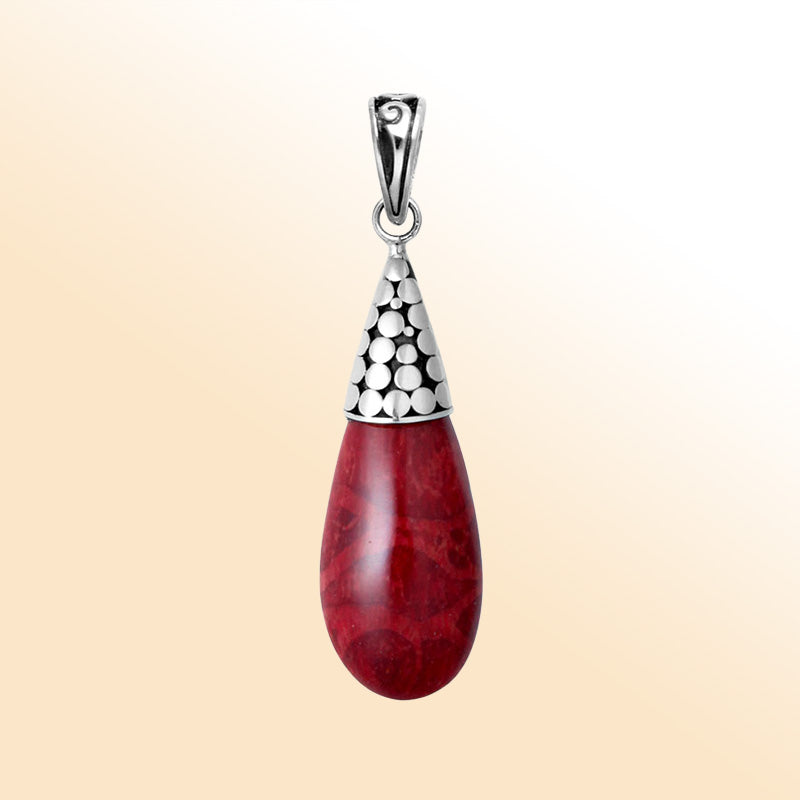 Elegant sterling silver teardrop pendant with red coral and polished Balinese dotted cap handcrafted in Bali.