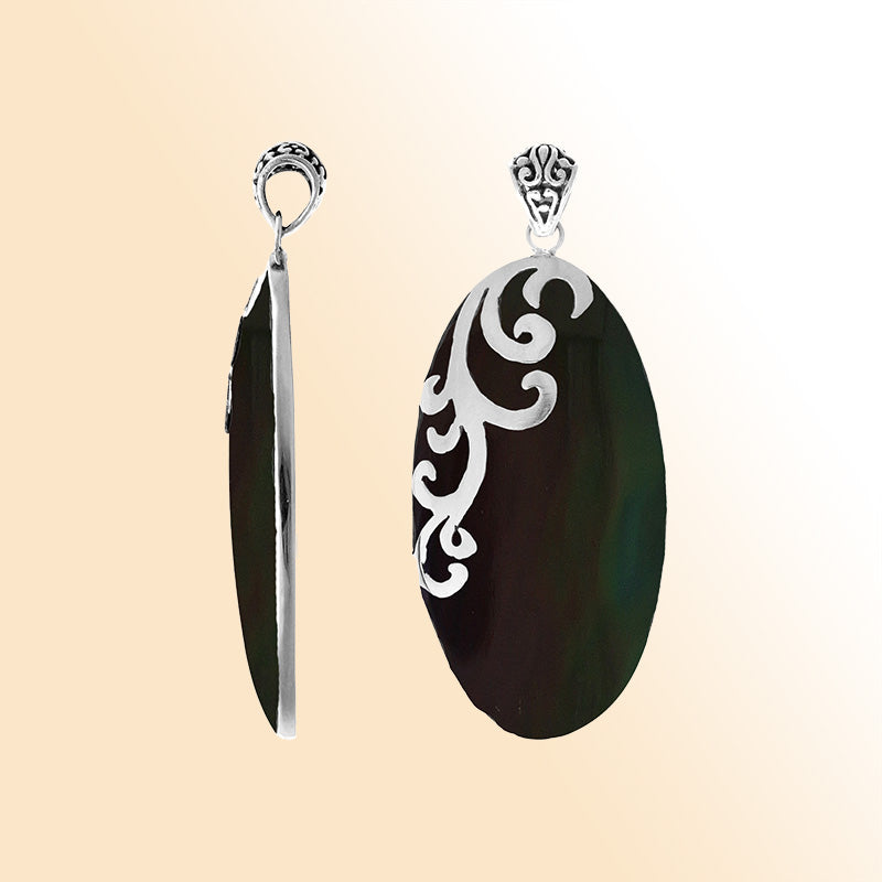 Elegant sterling silver Black Shell pendant with handcrafted scroll design made in Bali.