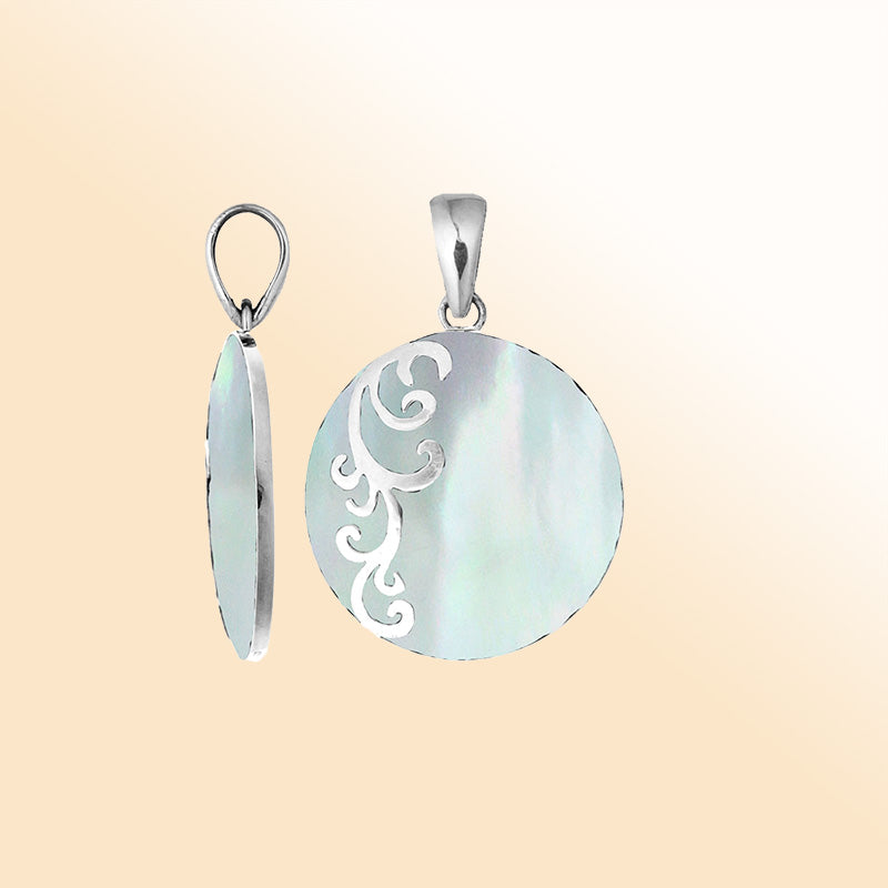 Artisan sterling silver pendant with luminous Mother of Pearl and flowing swirl accents.