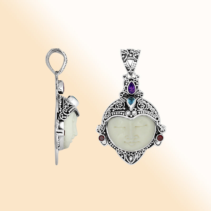 Artistic sterling silver Bone Face pendant with garnet, topaz and amethyst.