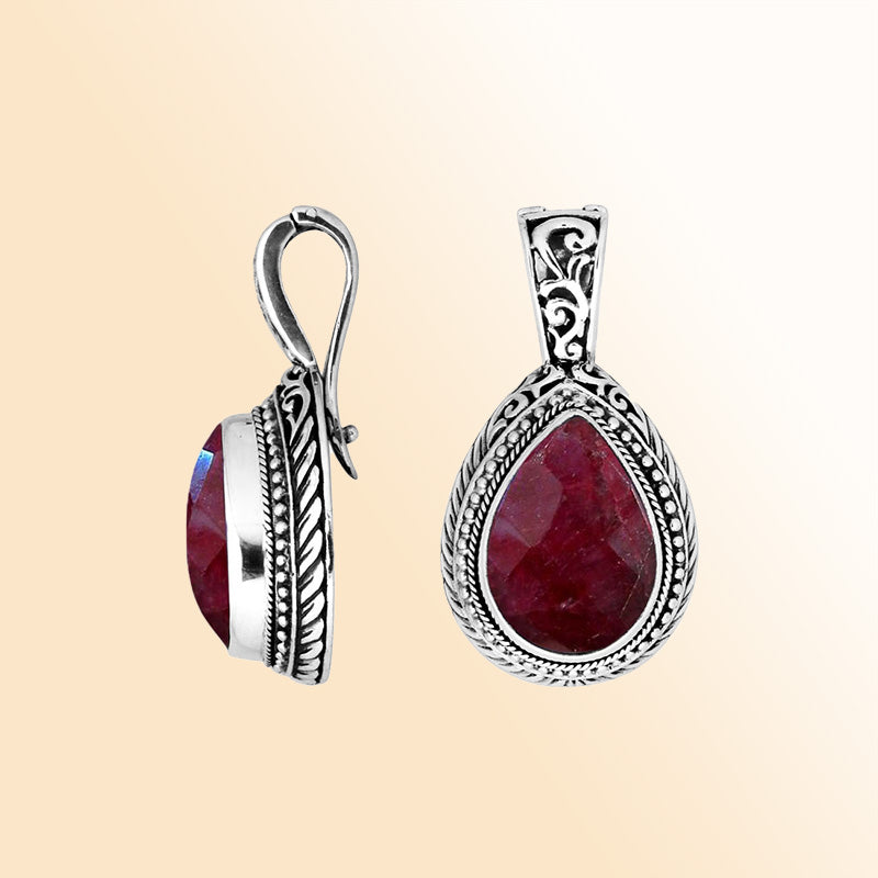 Handcrafted sterling silver teardrop pendant featuring Ruby Quartz with artistic Balinese detailing and a high-gloss polished finish.