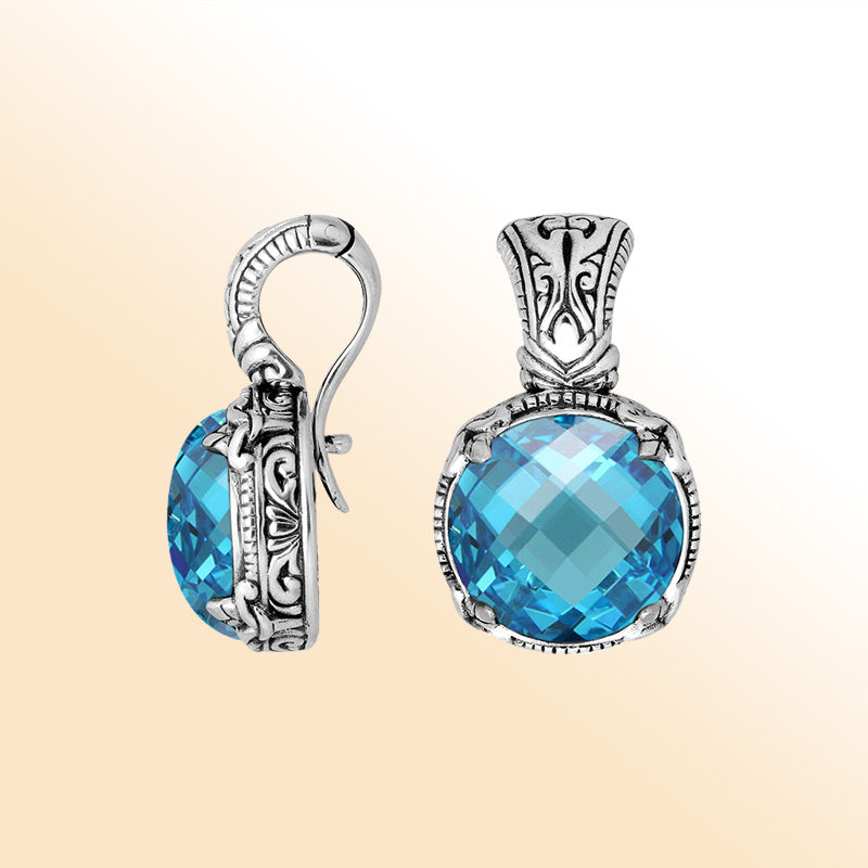 Handcrafted sterling silver cushion pendant featuring Blue Topaz Quartz with artistic Balinese detailing and a polished glossy finish.