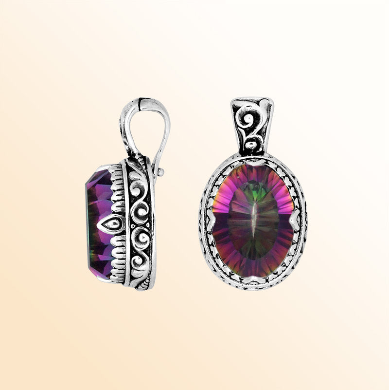Handcrafted sterling silver pendant featuring a vibrant Mystic Quartz centerpiece surrounded by artistic scroll carvings and a smooth decorative frame for expressive personal styling.