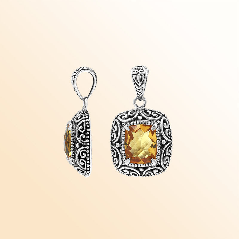 Handcrafted sterling silver cushion pendant featuring a faceted Citrine Quartz center enriched with artistic Balinese scroll carvings and a polished decorative frame.