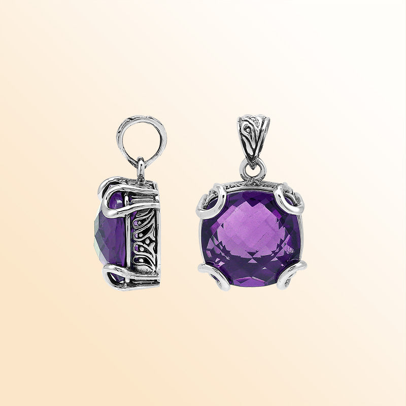 Handcrafted sterling silver cushion pendant featuring a faceted Amethyst Quartz centerpiece held with artistic prong work and fine Balinese carved detailing.
