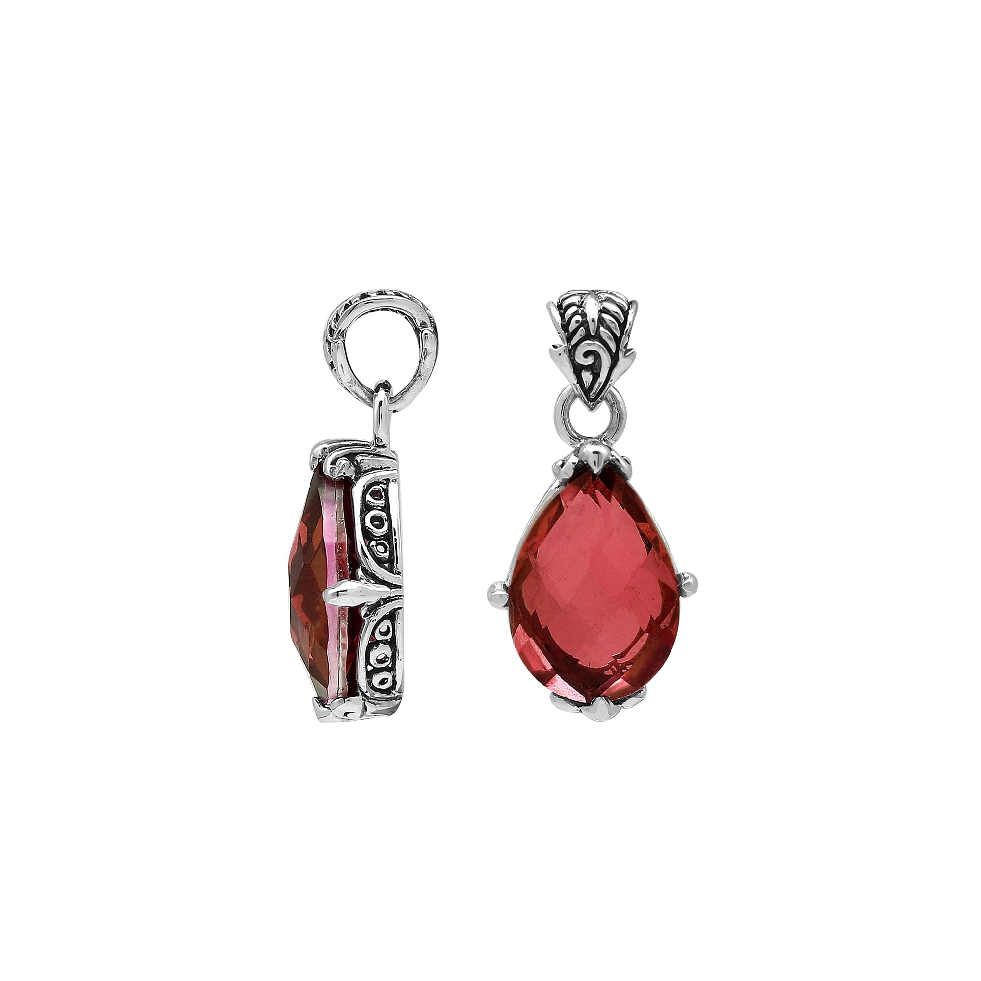 Handcrafted sterling silver pear-shaped pendant featuring a faceted Red Garnet Quartz centerpiece with expressive prong work and decorative Balinese carved detailing.