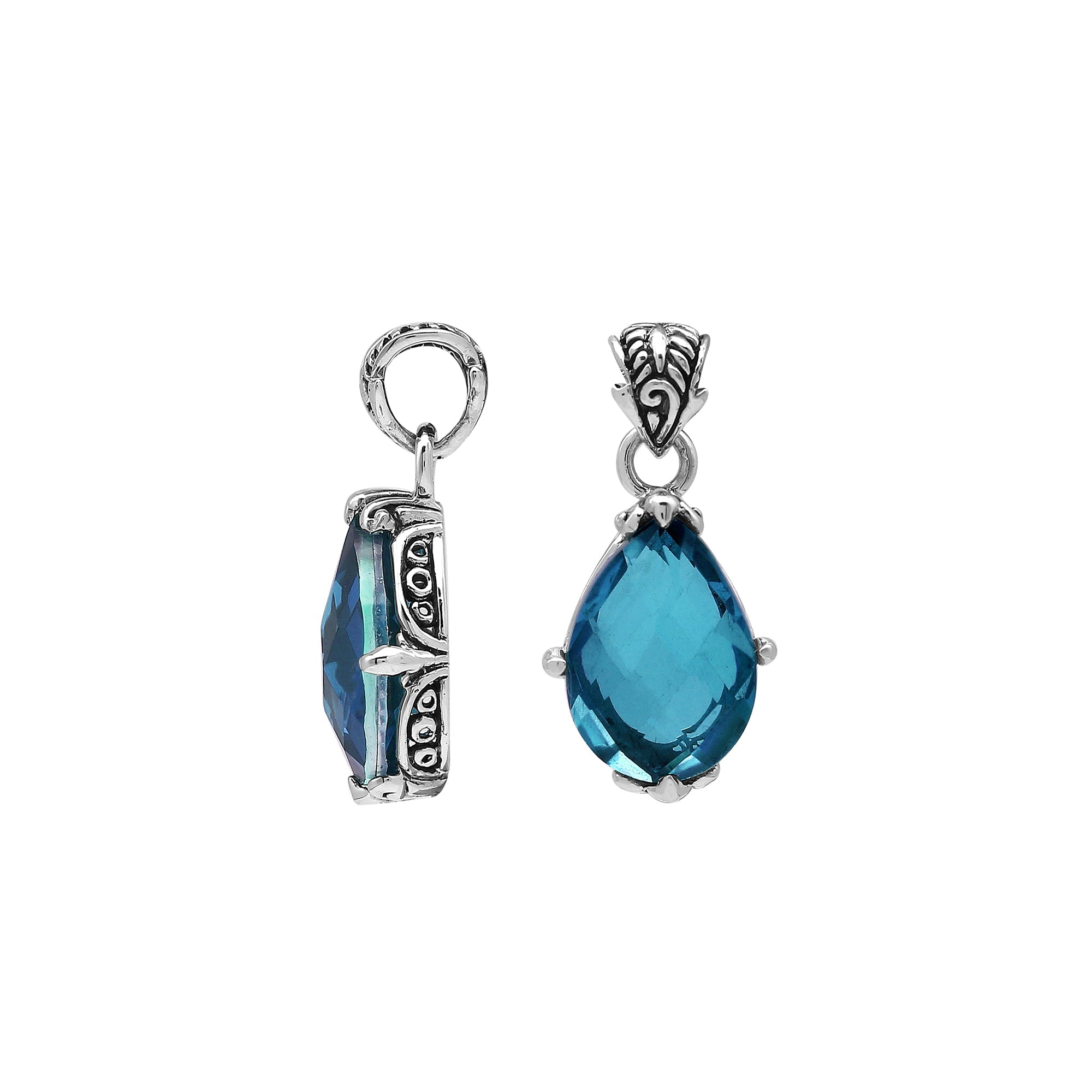 Handcrafted sterling silver pear-shaped pendant featuring a faceted London Blue Topaz Quartz centerpiece with expressive prong-setting and intricate Balinese carved accents.