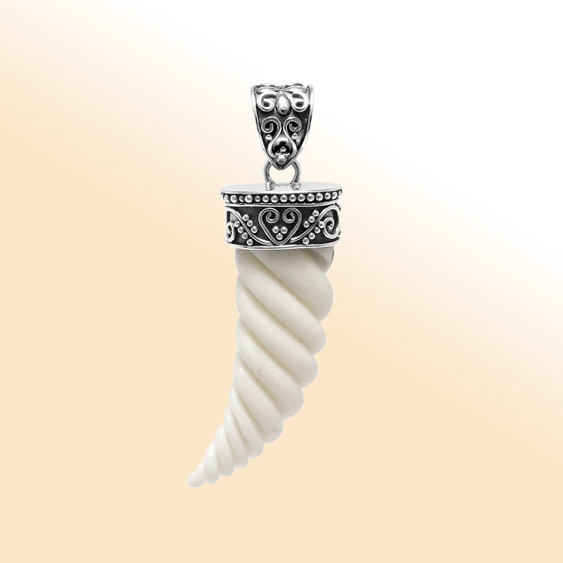 Artistic sterling silver spiral horn bone pendant with decorative Balinese patterned cap and polished finish designed for modern expressive jewelry wearers