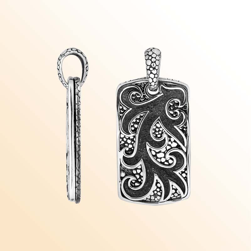 Artistic sterling silver rectangle pendant with swirl carved design and texture.