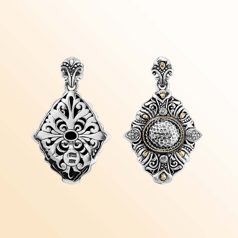 Artistic sterling silver and 18K gold pendant with diamond and hammered detailing.