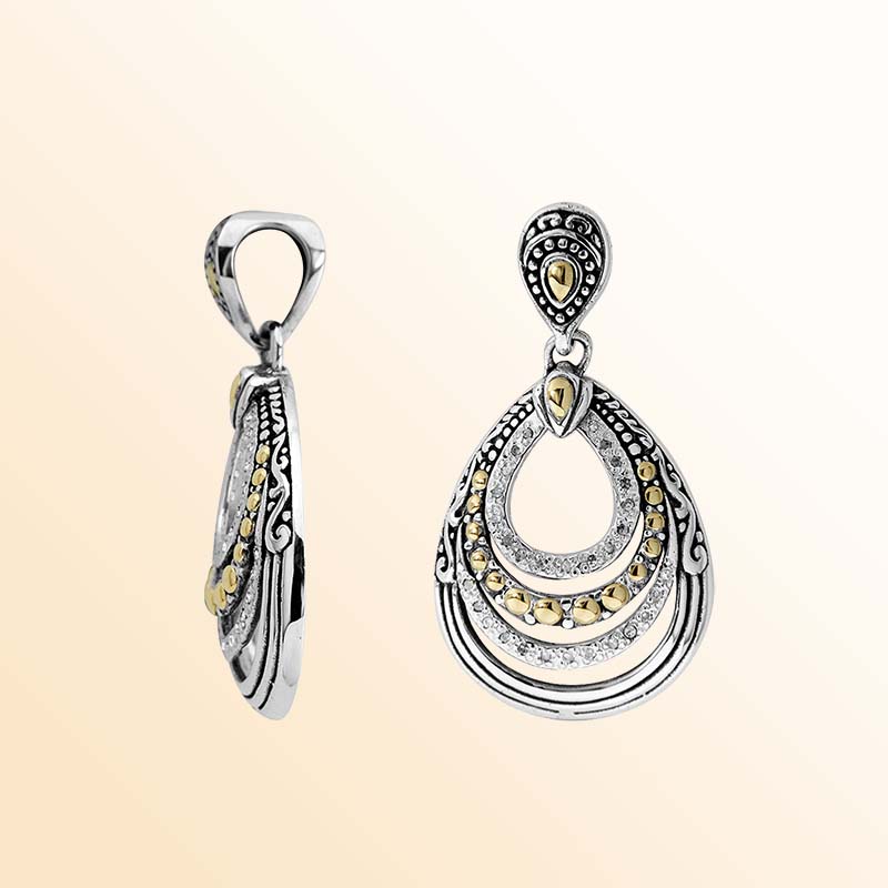 Artistic teardrop silver pendant with gold and diamond accents
