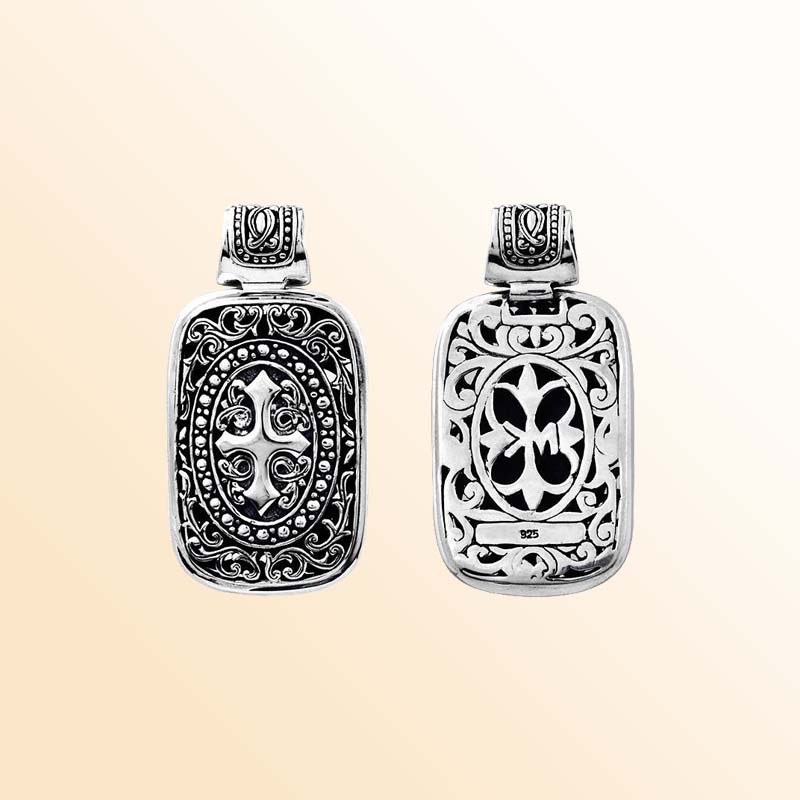 A handcrafted Silver Overlay Over Copper rectangular pendant featuring ornate Balinese scrollwork, oxidized detailing, polished overlay accents, and artistic silverwork designed for elegant daily or occasion wear.