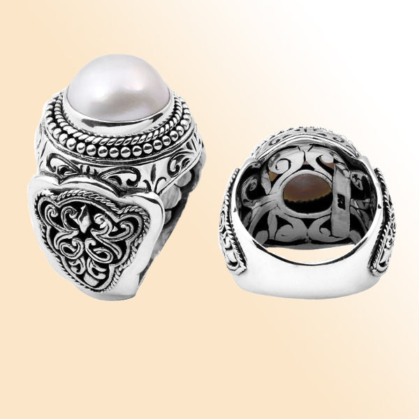 Handcrafted sterling silver Bali ring with luminous white Mabe Pearl and detailed scrollwork design.