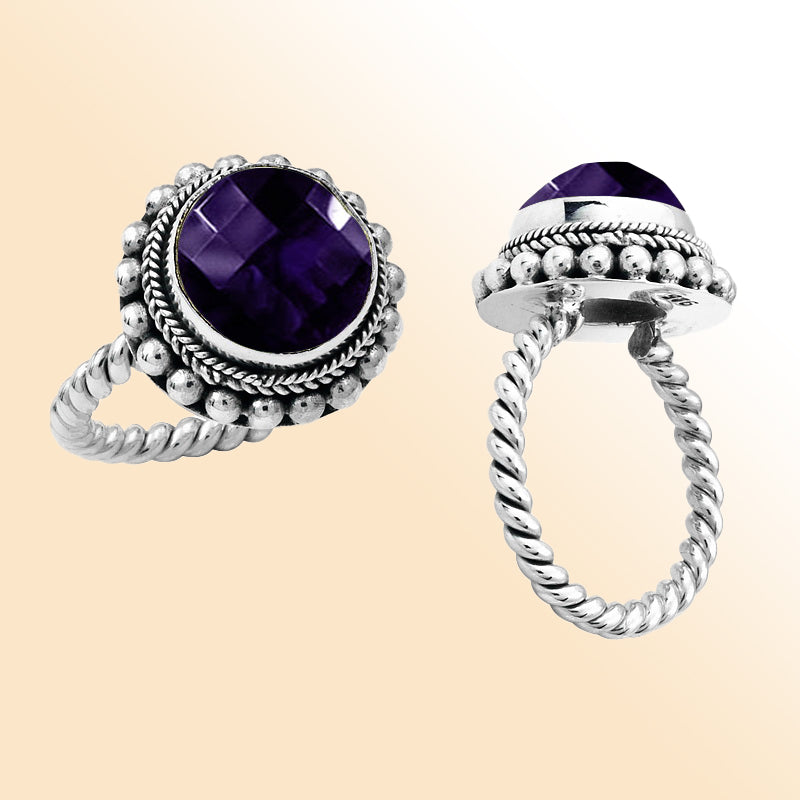 Handcrafted sterling silver Bali ring with faceted Amethyst Quartz and twisted rope band design.
