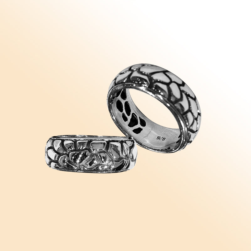 Sterling silver wide band ring with intricate Bali-inspired carved pattern, handcrafted artisan jewelry for everyday wear.