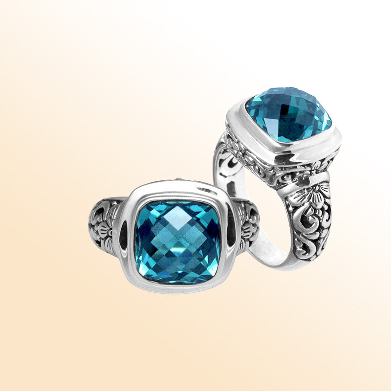 Handcrafted Bali silver ring with cushion-cut Blue Topaz Quartz and artisan carvings.