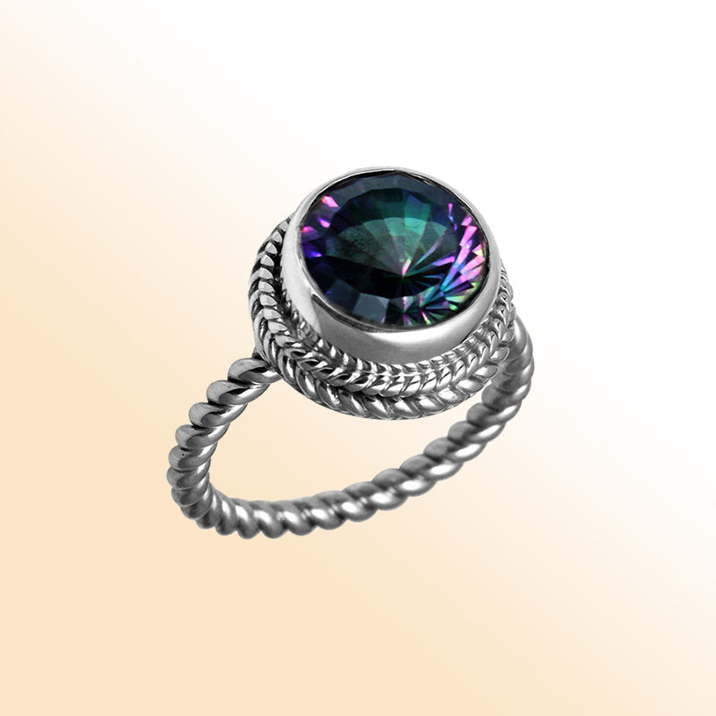 Handcrafted Bali silver ring with a round Mystic Topaz Quartz and rope-style band.