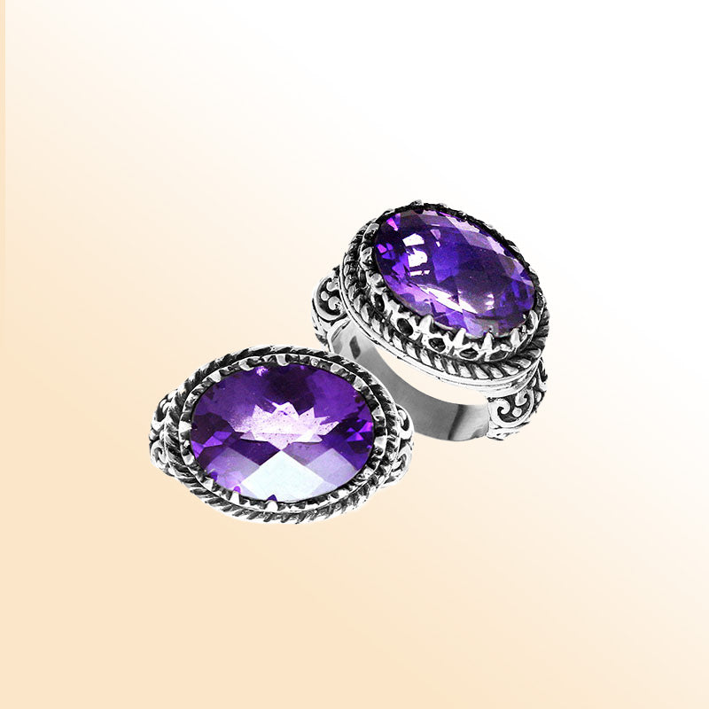 Handmade sterling silver Balinese ring with faceted Amethyst Quartz and detailed carvings.
