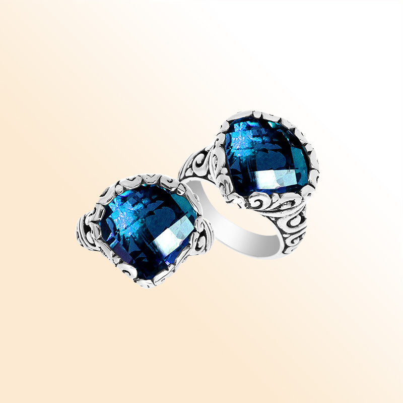 Handmade sterling silver Balinese ring with cushion-cut London Blue Topaz Quartz and scrollwork detailing.