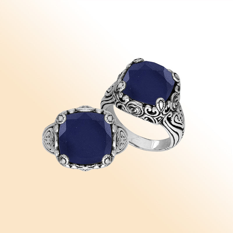Sterling Silver vintage-inspired ring featuring Blue Sapphire and an ornate handcrafted Balinese design.