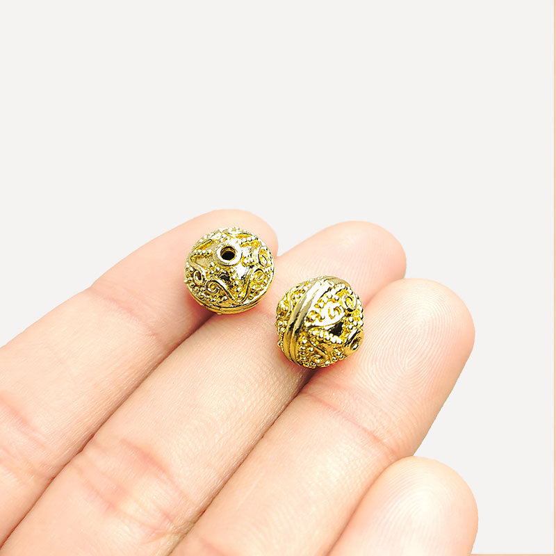 India-made 18K gold overlay copper filigree bead with polished textured design for jewelry.