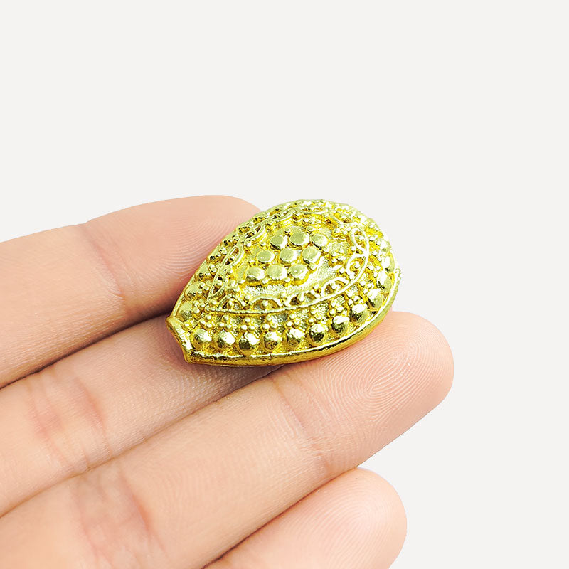 Handcrafted oval copper bead with 18K gold overlay from India featuring detailed dotted texture for jewelry making.
